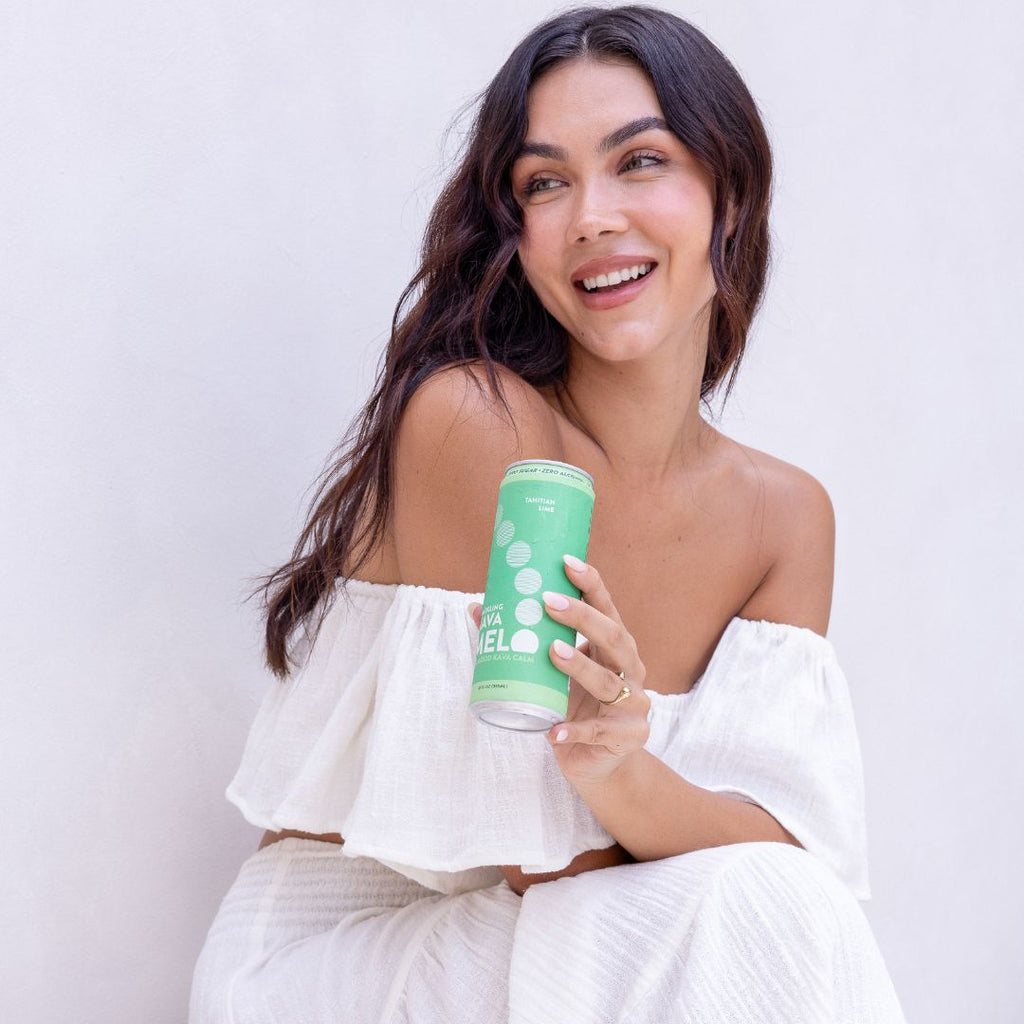 Woman holding a green cup with a white background