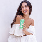 Woman holding a green cup with a white background